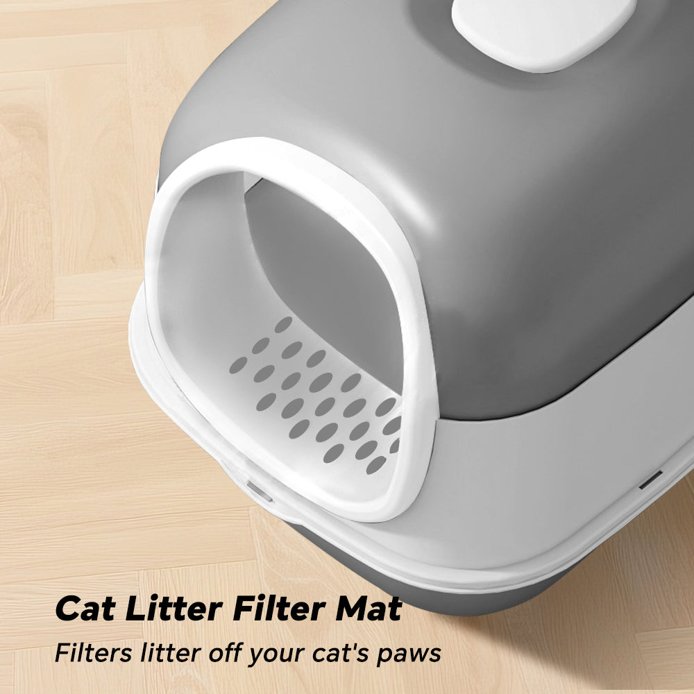 Cat litter filter mat with text on a wooden surface