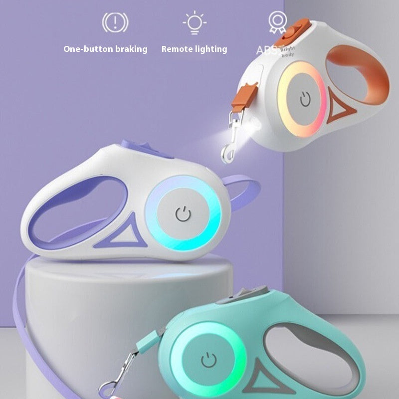 Three colorful retractable dog leash with LED lights on a light purple background  
