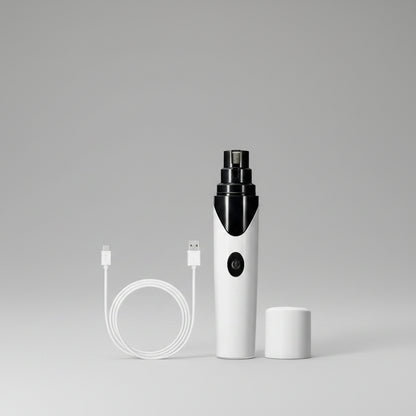 White electronic Pet Nail Grinder device with black accents and USB cable on a white background
