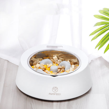 White slow feeder bowl with food inside on a light wooden surface.
